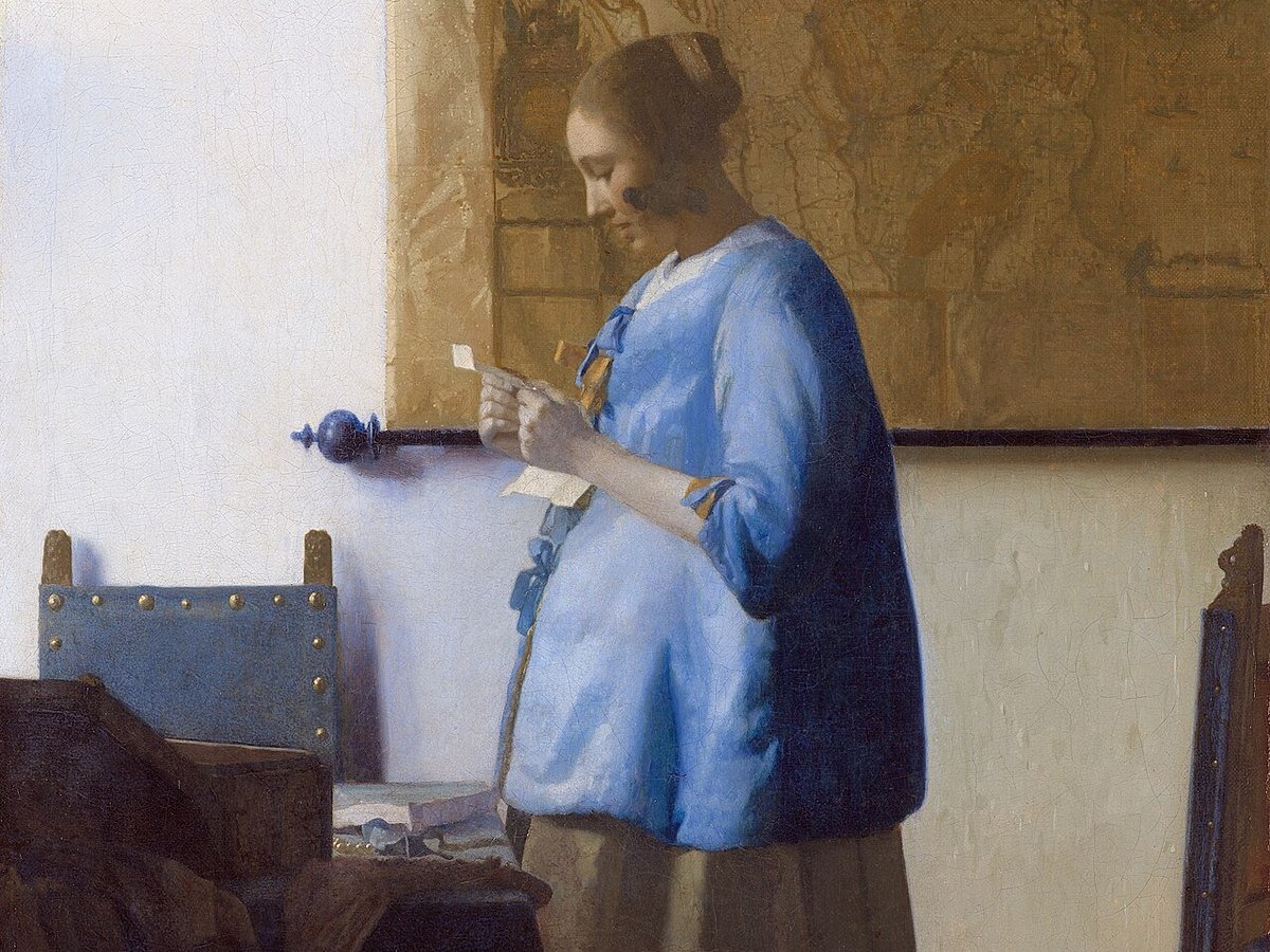 Vermeer's Woman in Blue Reading a Letter, a woman alone reading correspondence by a window.