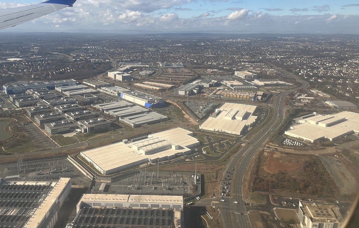Aerial view of the data center corridor in Ashburn, Virginia, with electrical substations between the buildings