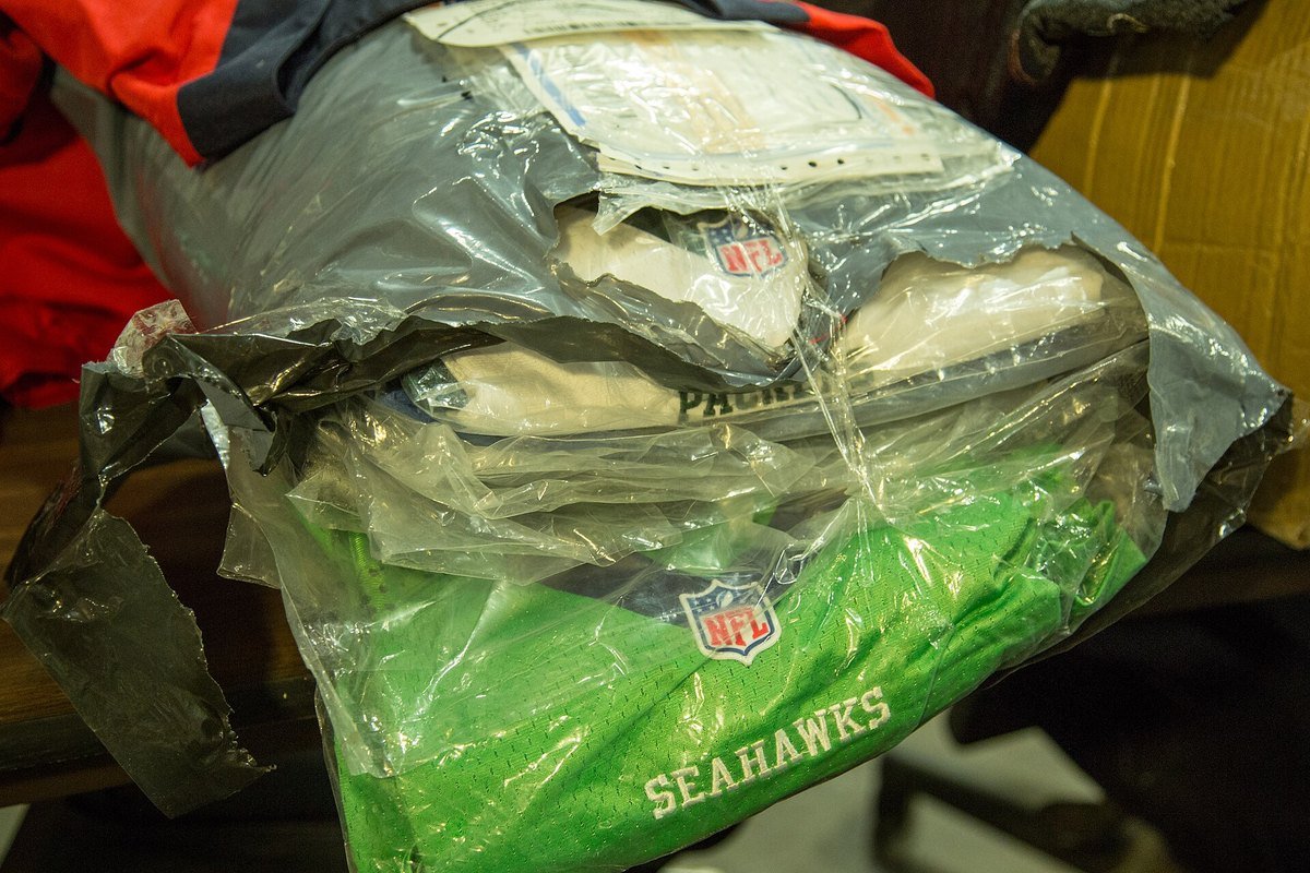 Counterfeit NFL jerseys in a plastic bag, seized at the JFK International Mail Facility