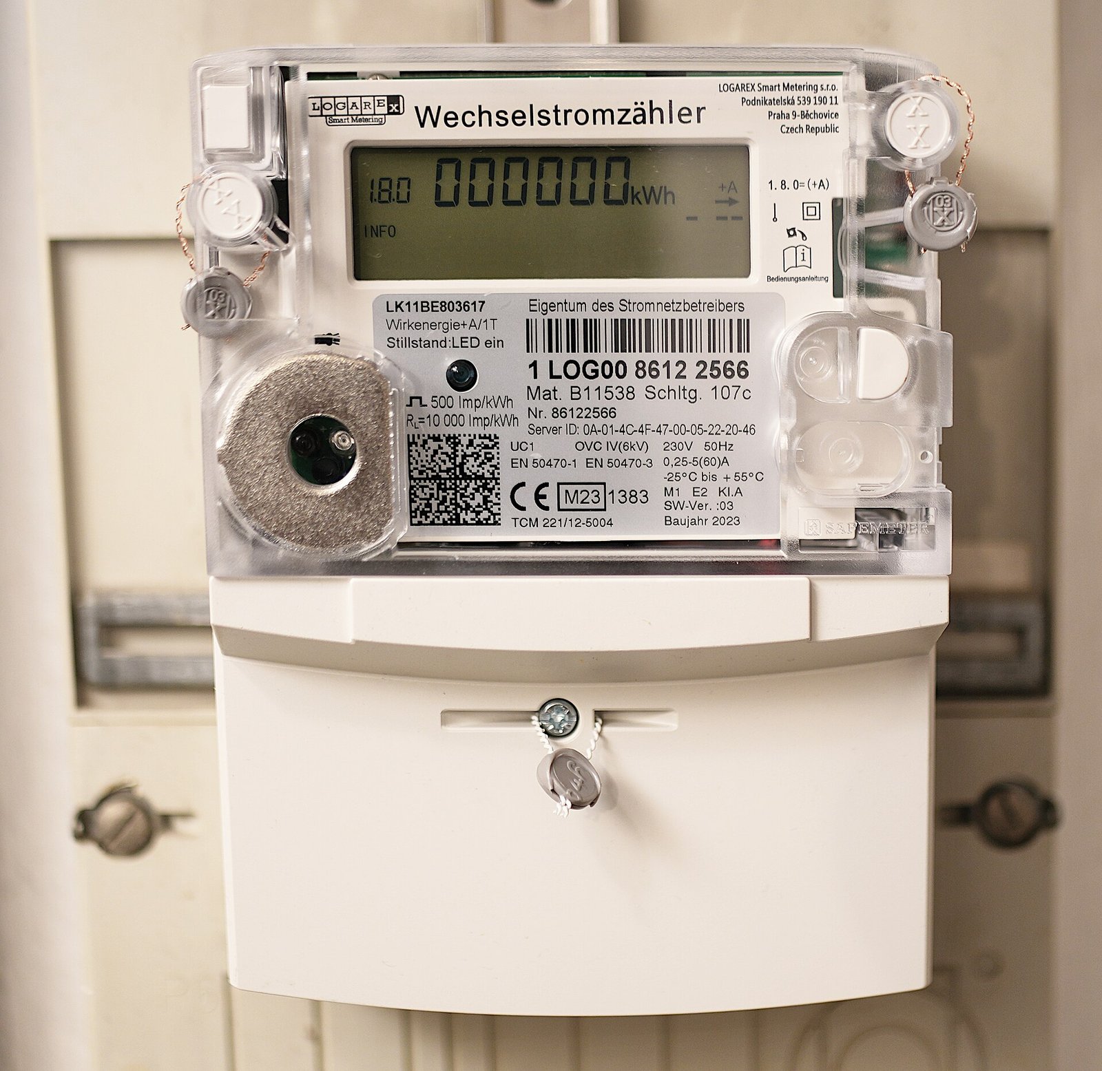 A household electricity meter with its display reading zero kilowatt-hours