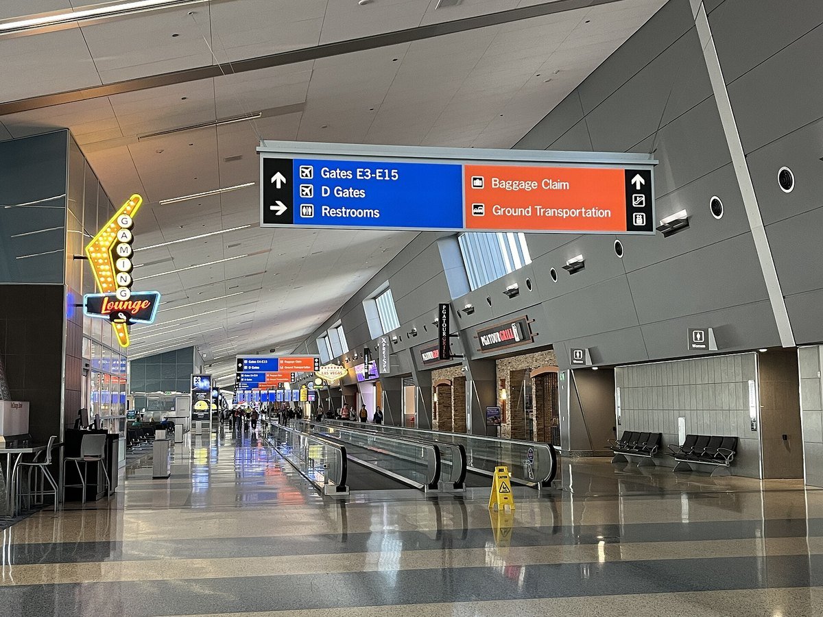 Concourse signage at Harry Reid International Airport in Las Vegas pointing to Baggage Claim and Ground Transportation