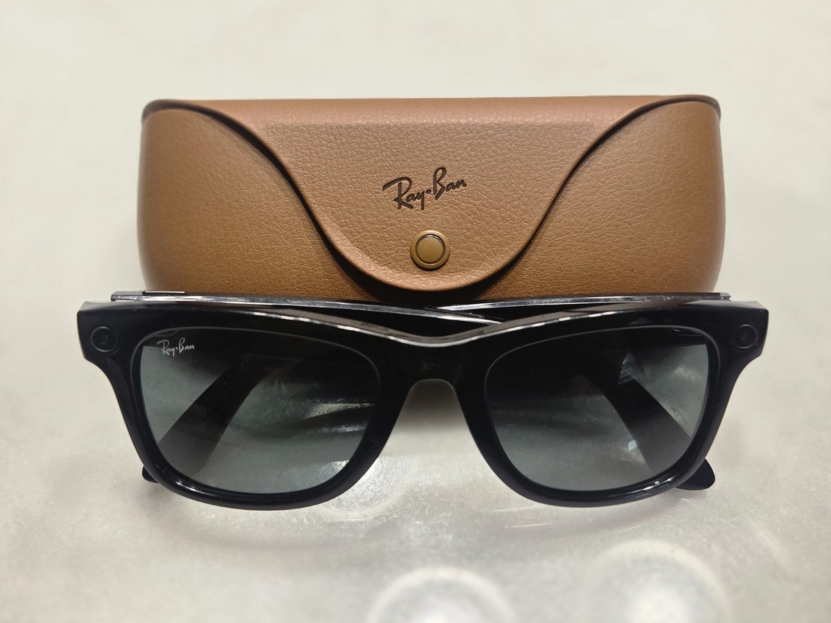 Front view of Ray-Ban Meta smart glasses showing the dark camera bezel in the top corners of the frame front