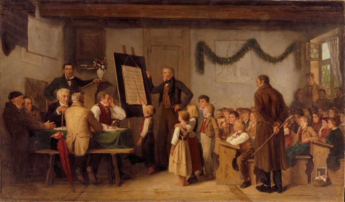 A 19th-century painting of a village school examination, with inspectors seated at a table watching the teacher.