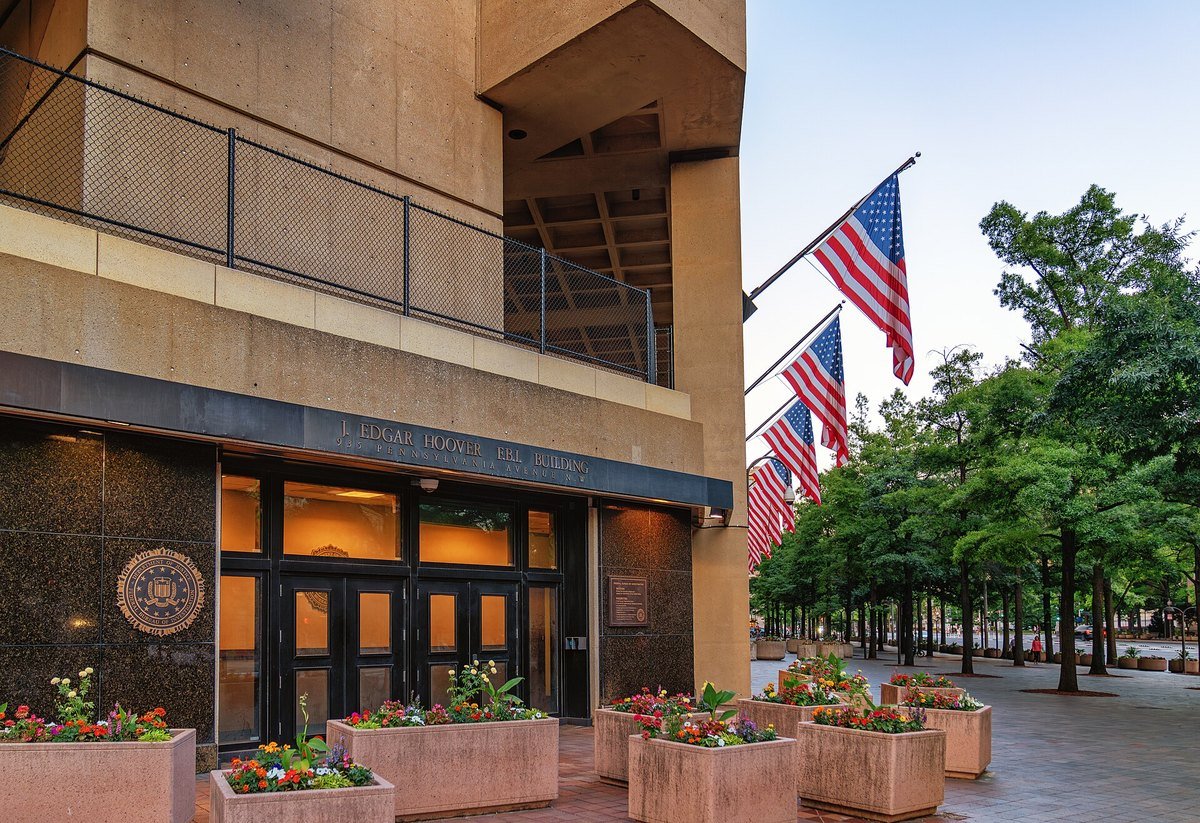 The J. Edgar Hoover FBI Building entrance in Washington, D.C., with the FBI seal beside the doors