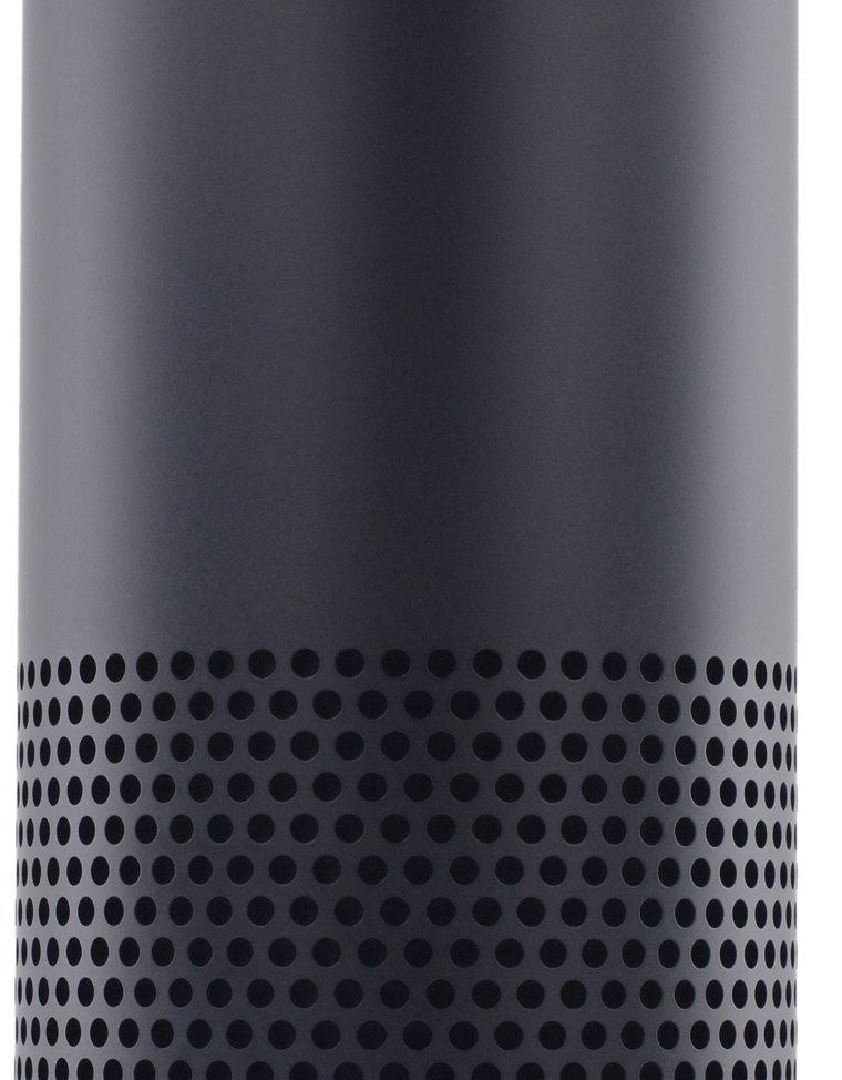 The original tall cylindrical Amazon Echo speaker with the amazon wordmark near its base