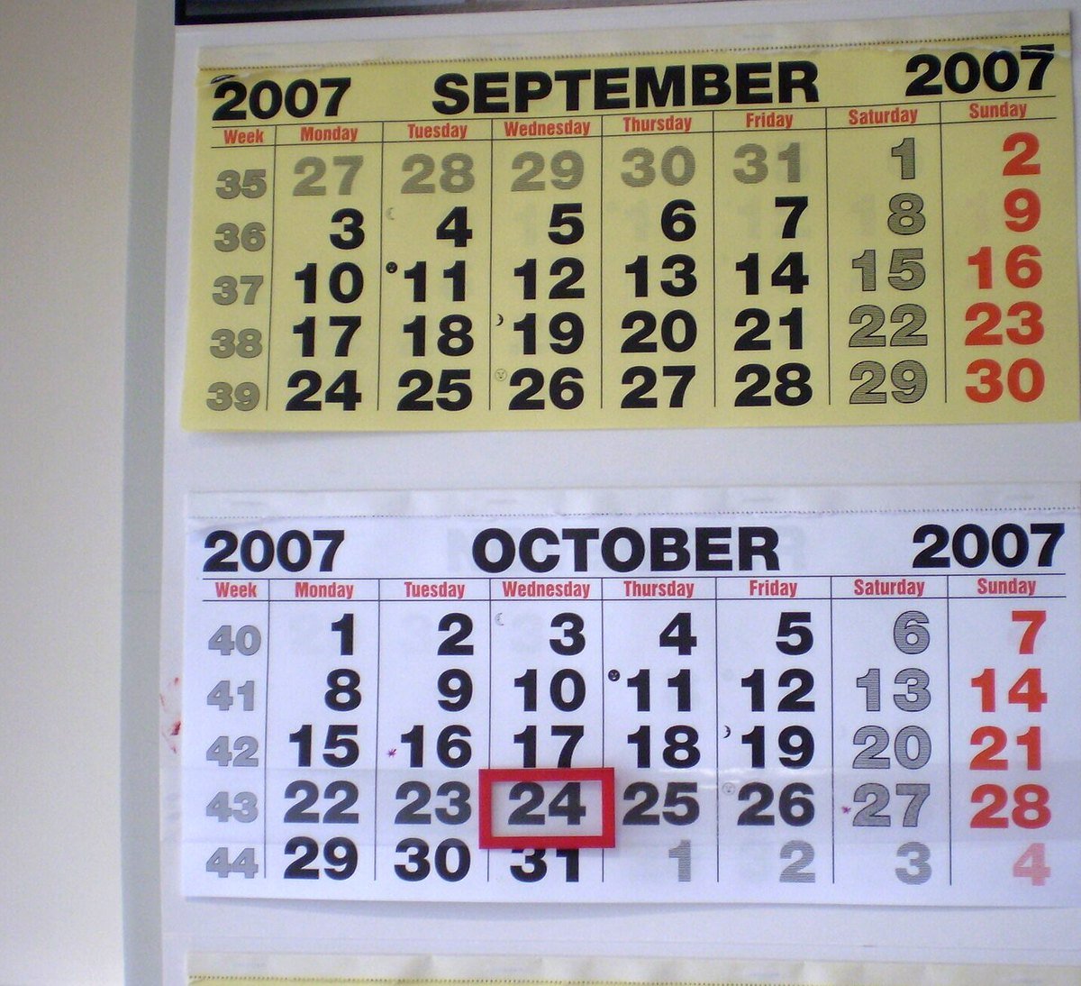 A wall calendar showing September and October with columns labelled Monday through Sunday and week numbers down the left.