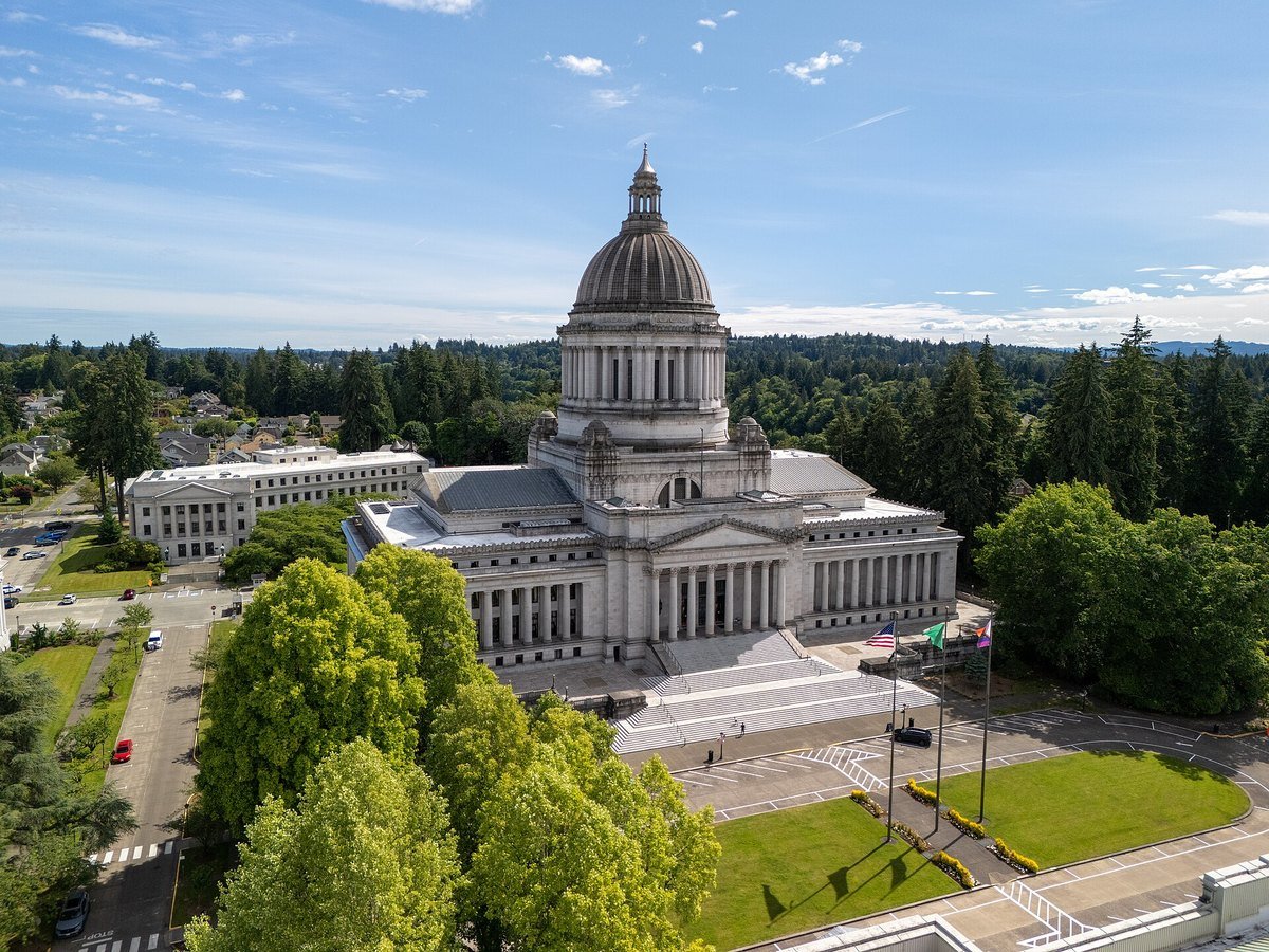 Aerial view of the Washington State Capitol in Olympia surrounded by evergreen trees