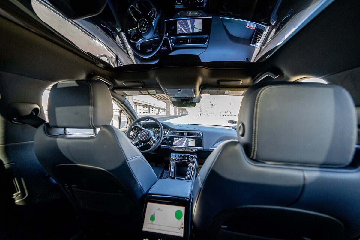 Interior of a Waymo robotaxi with an empty driver seat