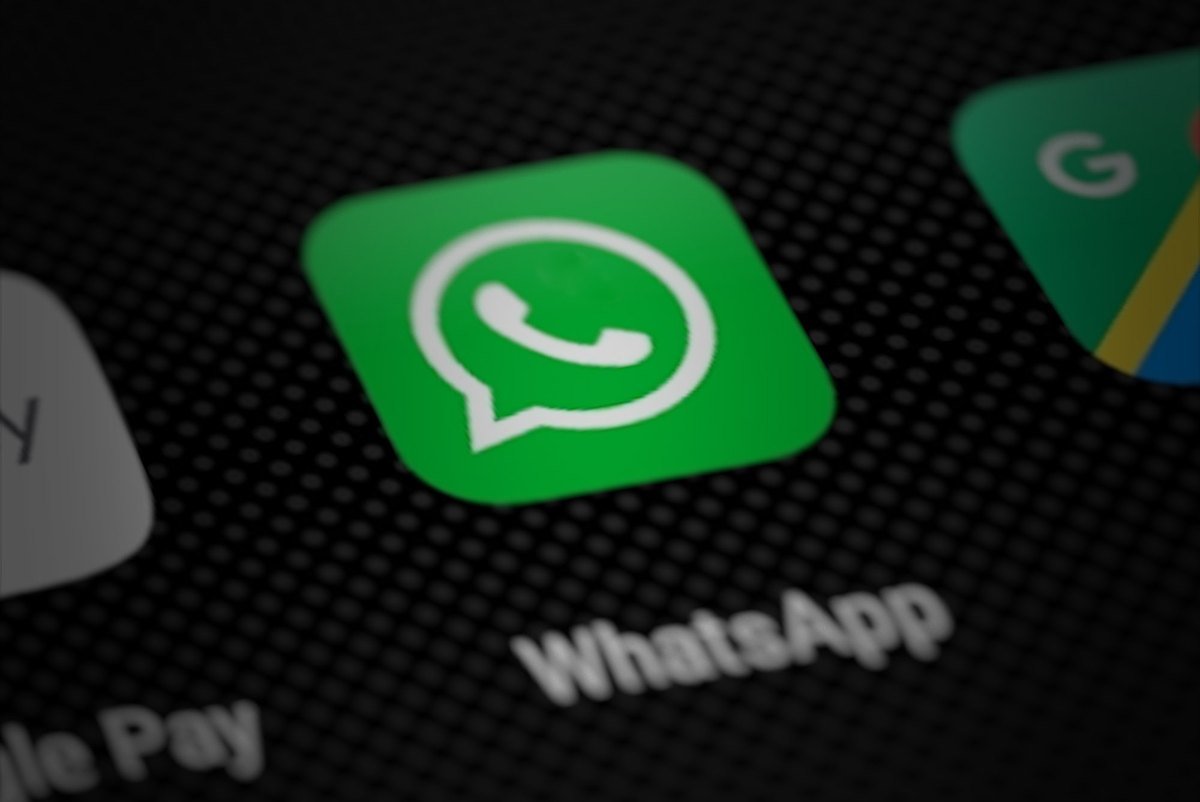 The WhatsApp icon on a phone home screen