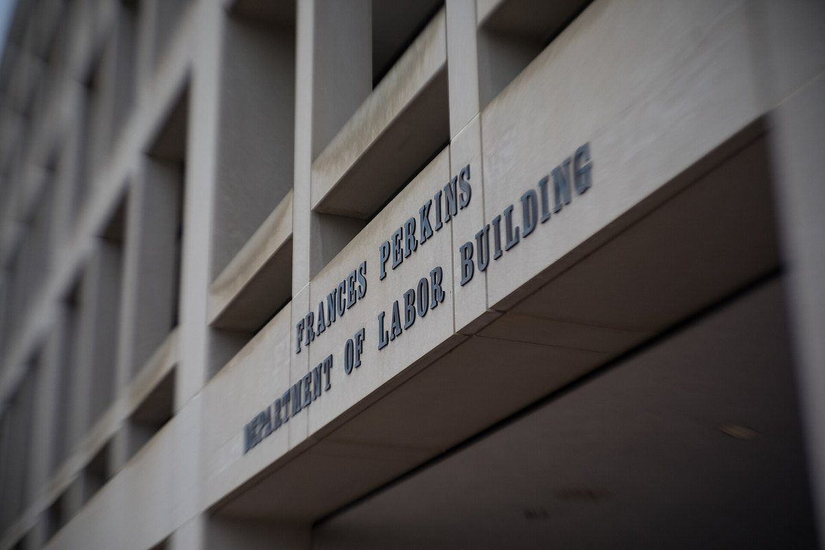 Raised lettering reading Frances Perkins Department of Labor Building on the concrete facade of the Labor Department headquarters in Washington, D.C.